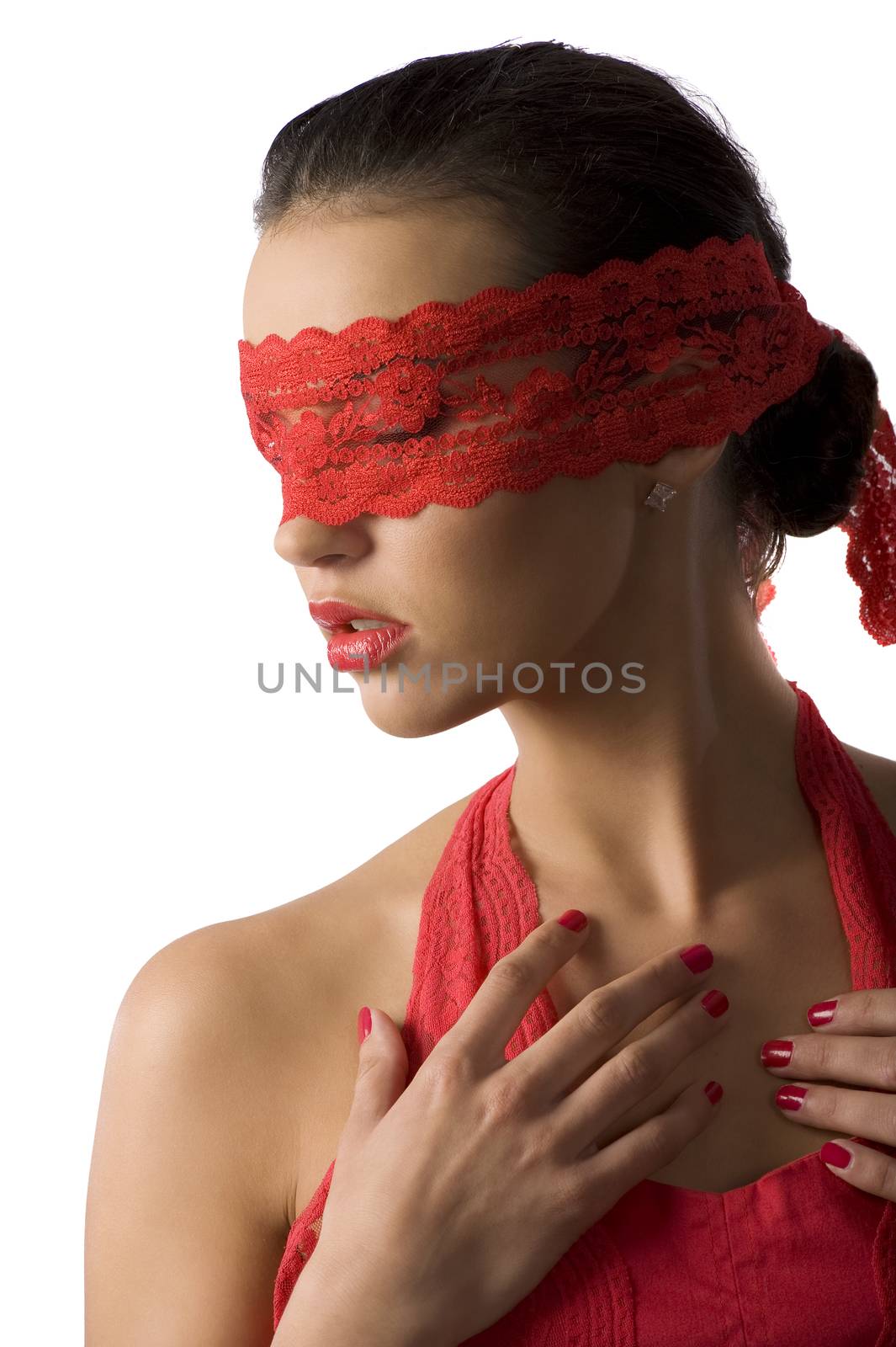 close up of a young cute brunette with a red lace mask looking down