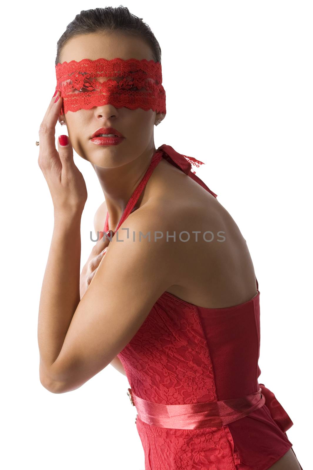 cute and sexy brunette in red shirt and a red lace mask with a hand near face