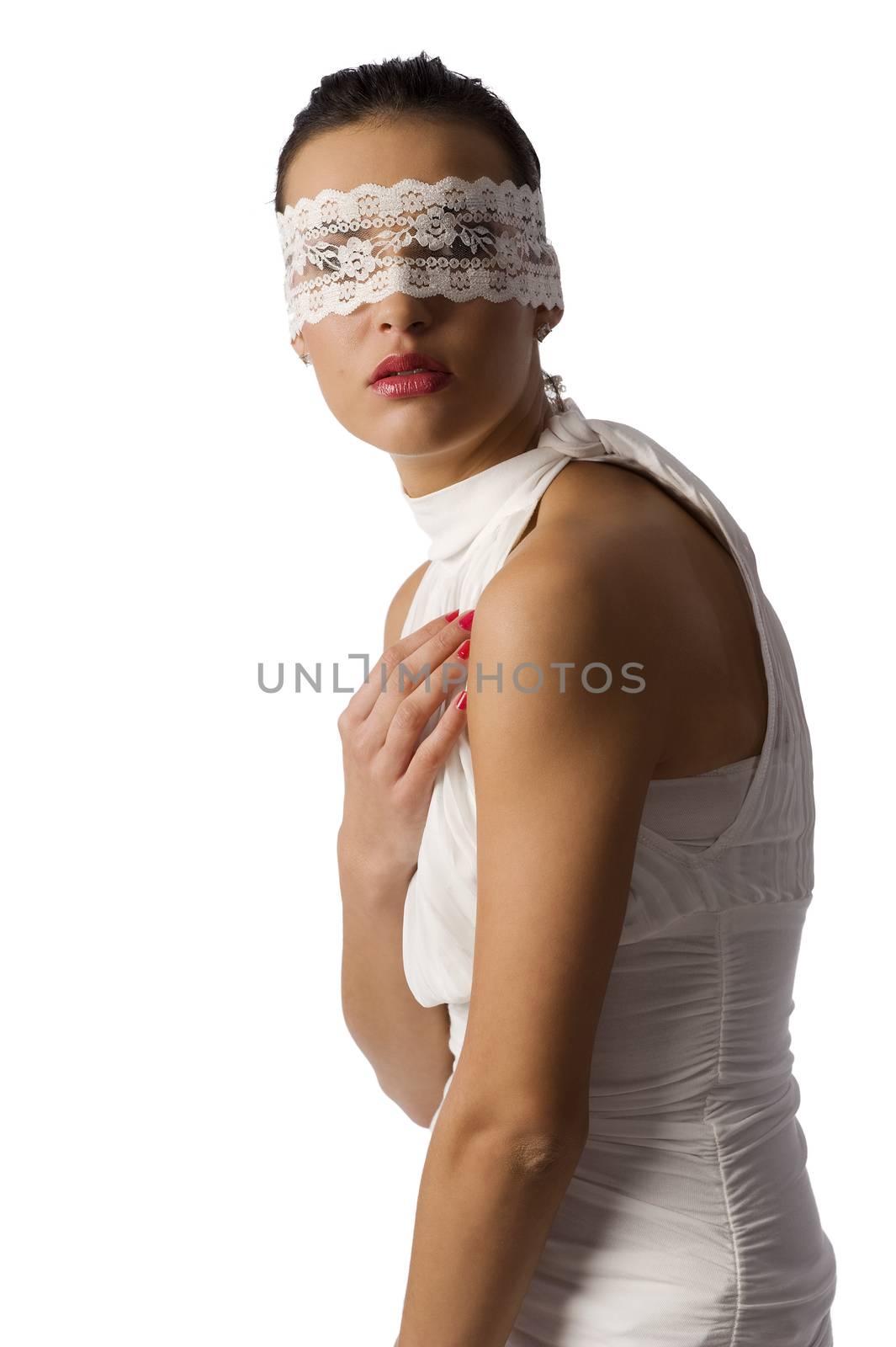 pretty young woman with dark hair wearing a white shirt and a white lace mask on black background