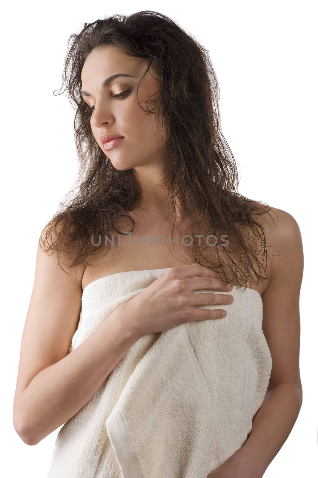 portrait of a young beauty brunette wearing a white towel and having wet hair