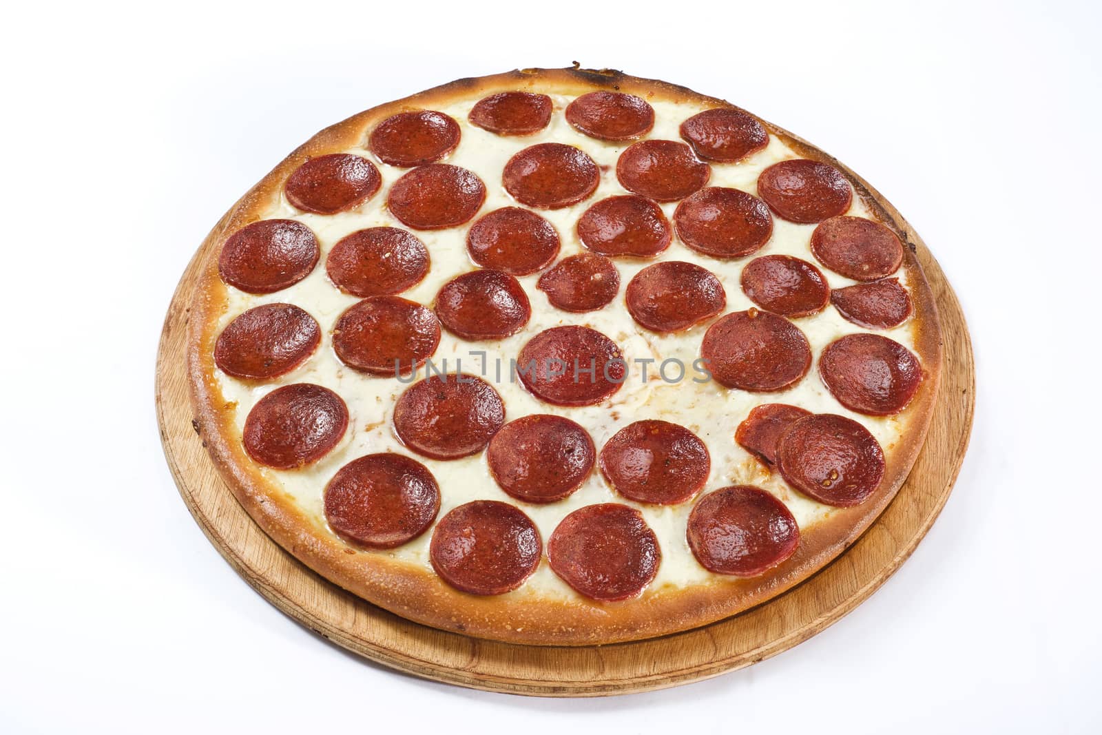 pizza with vegetables, ham, and mushrooms isolated on white