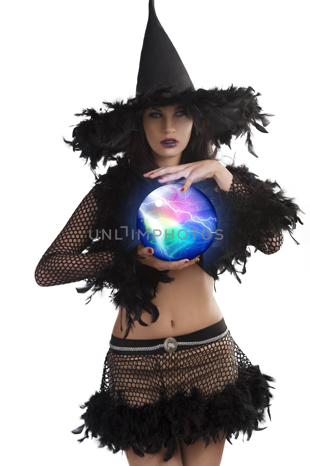close up portrait of a cute girl in witch black dress and hat reading a future with a ball against white background