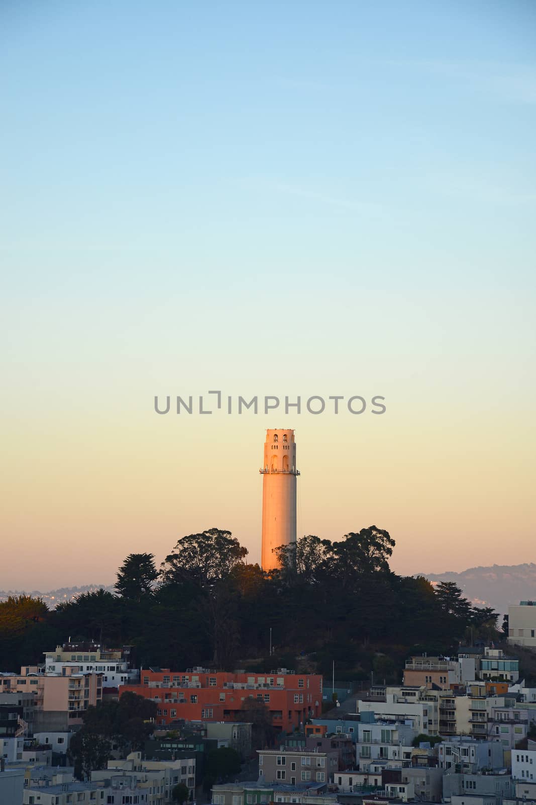 coit tower with sun light during sunset