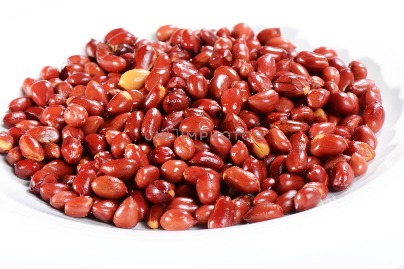 Chinese Food: fried peanut kernels in a white plate