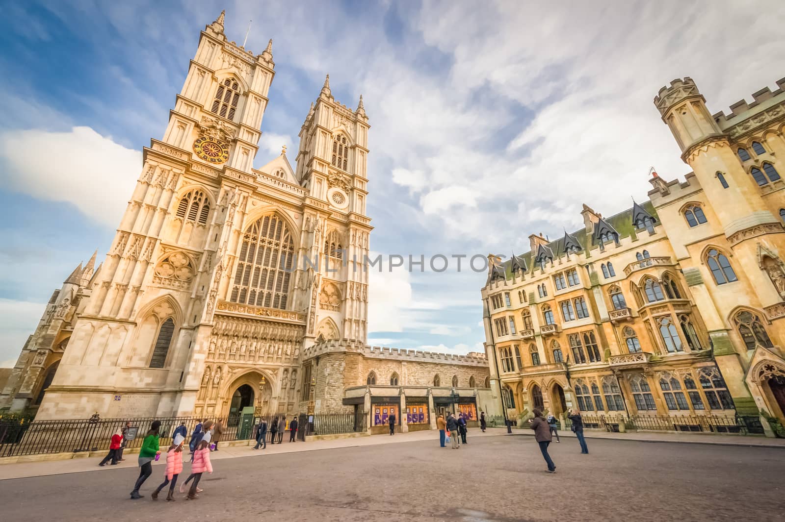 Sunset illuminating the yellow stonework towers of Westminster Abbey in central London, UK - January 27, 2013