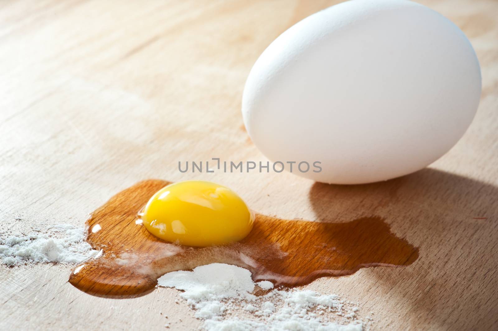 Ingridients for backing with egg and flour on a cutting board 