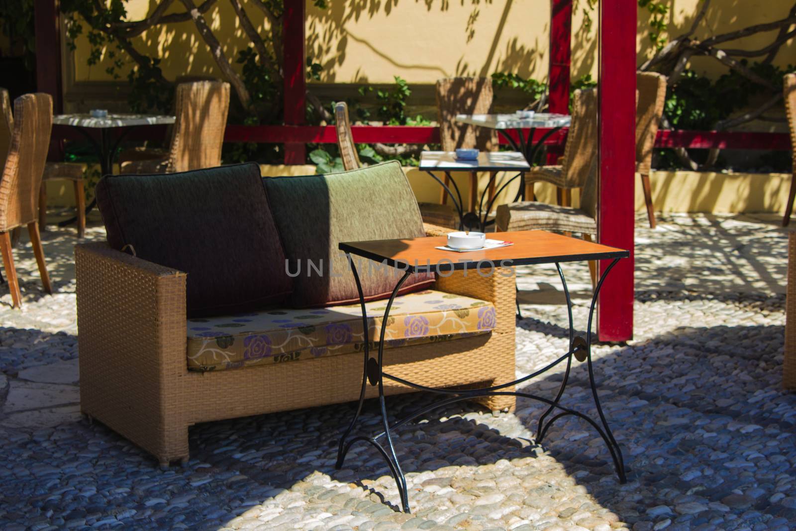 Sunny furniture in an outdoor restaurant/bar