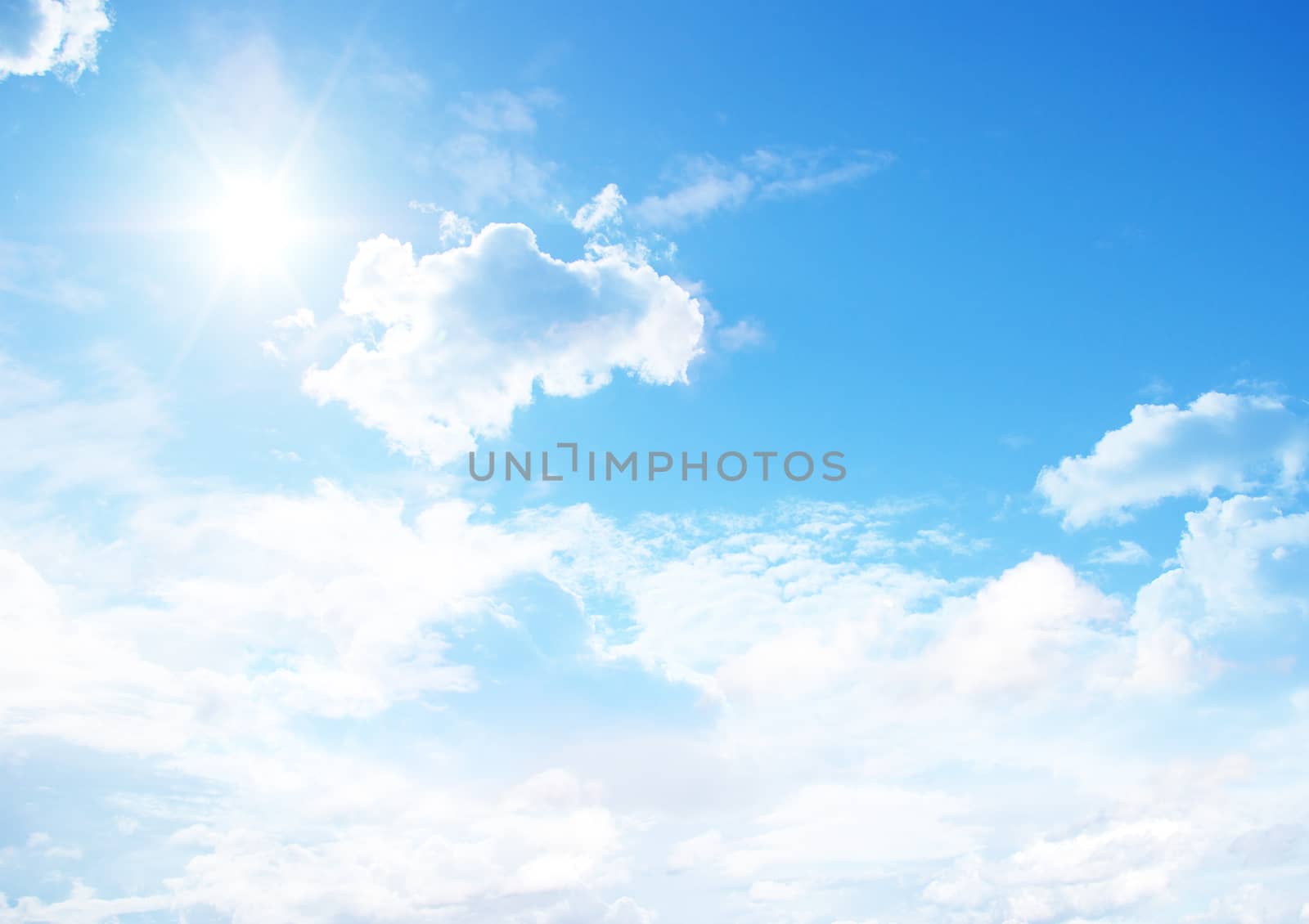 Blue sky with clouds and sun