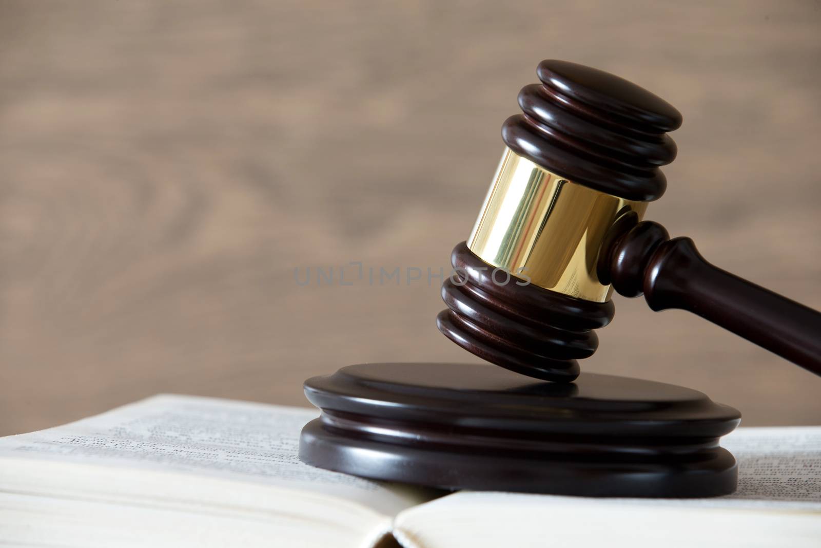 wooden gavel and books on wooden table