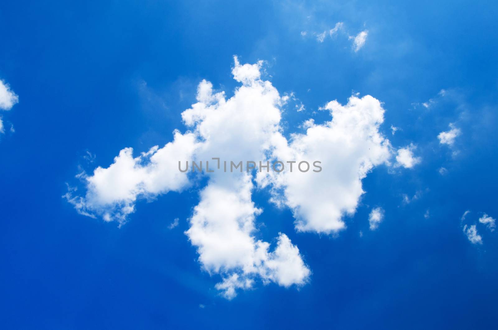 Blue sky background with a tiny clouds