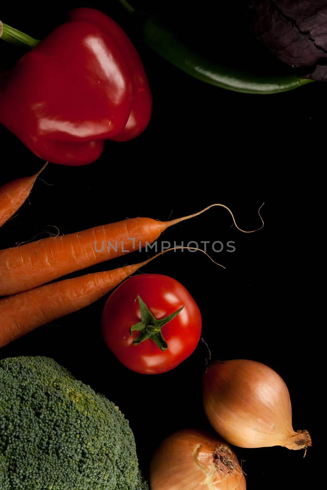 different vegetables shoot from above on black background