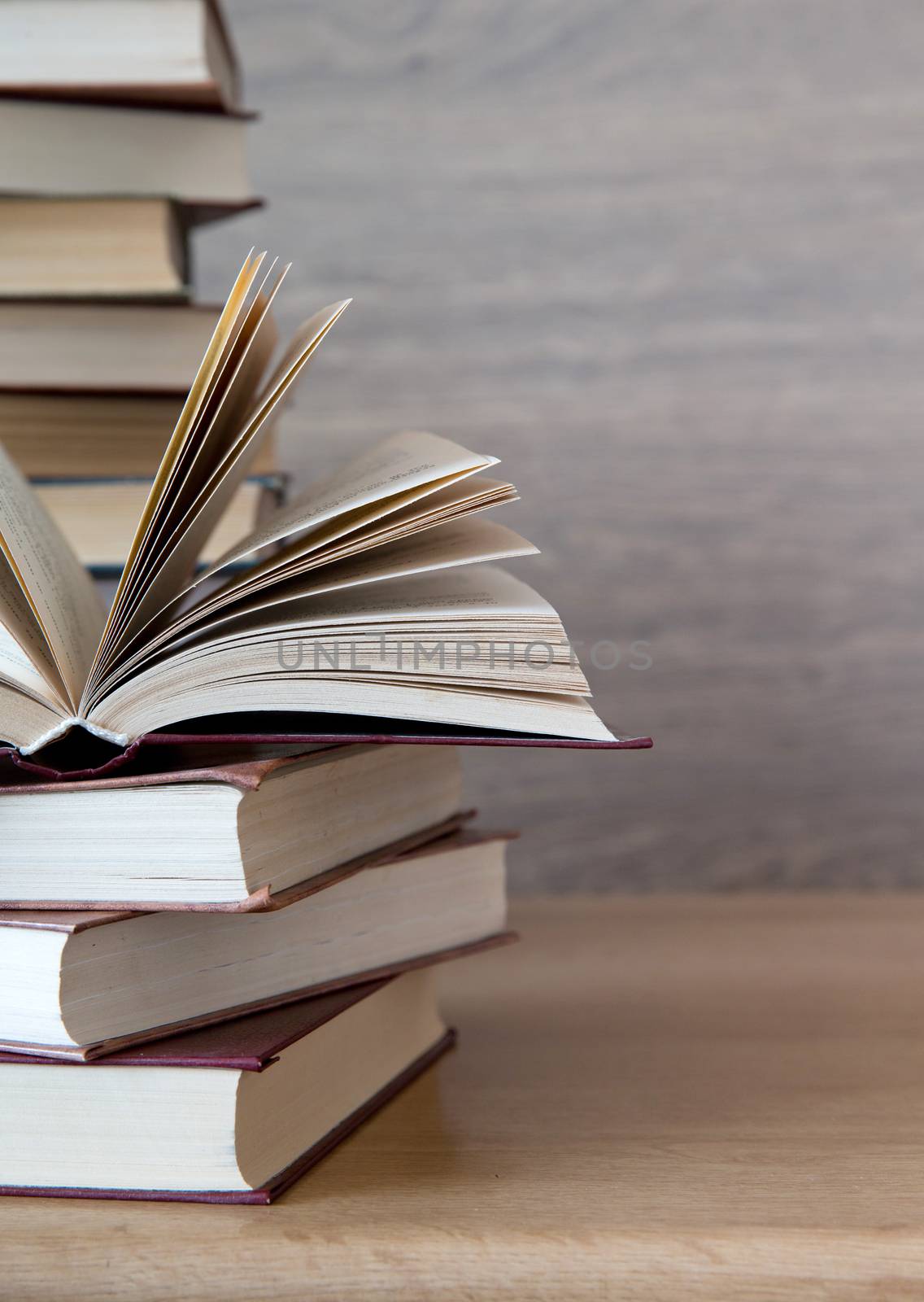 books on wooden deck tabletop