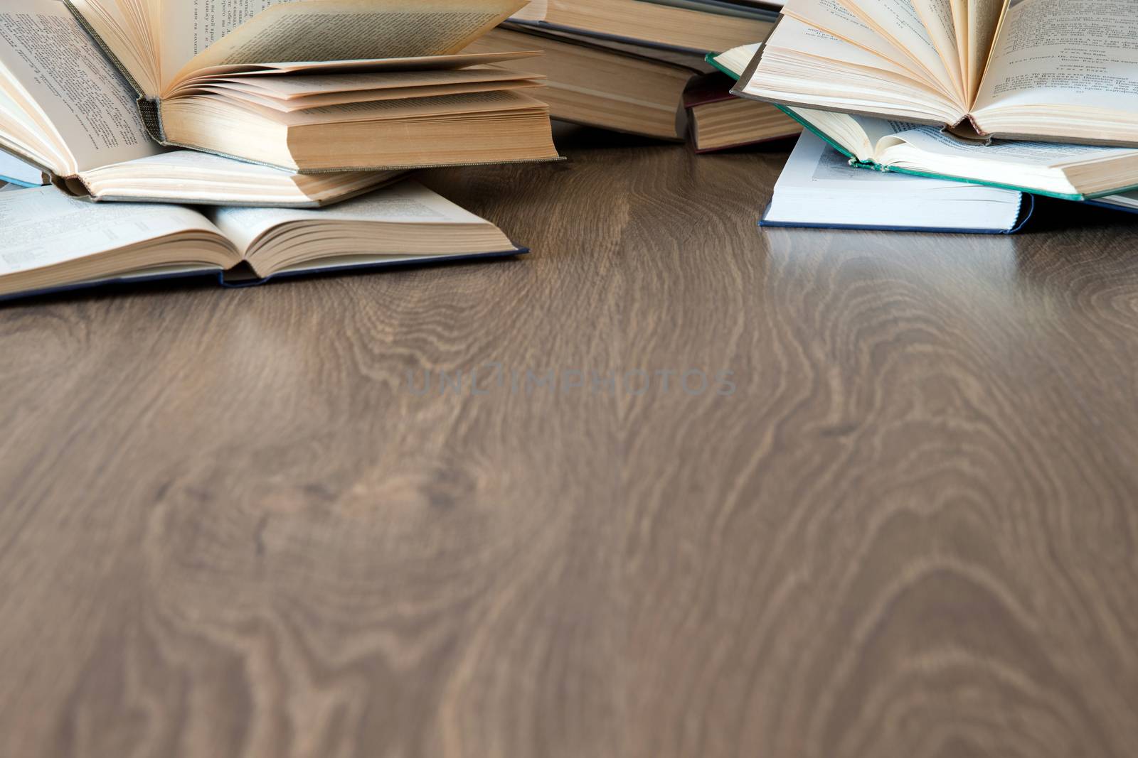 books on wooden deck tabletop