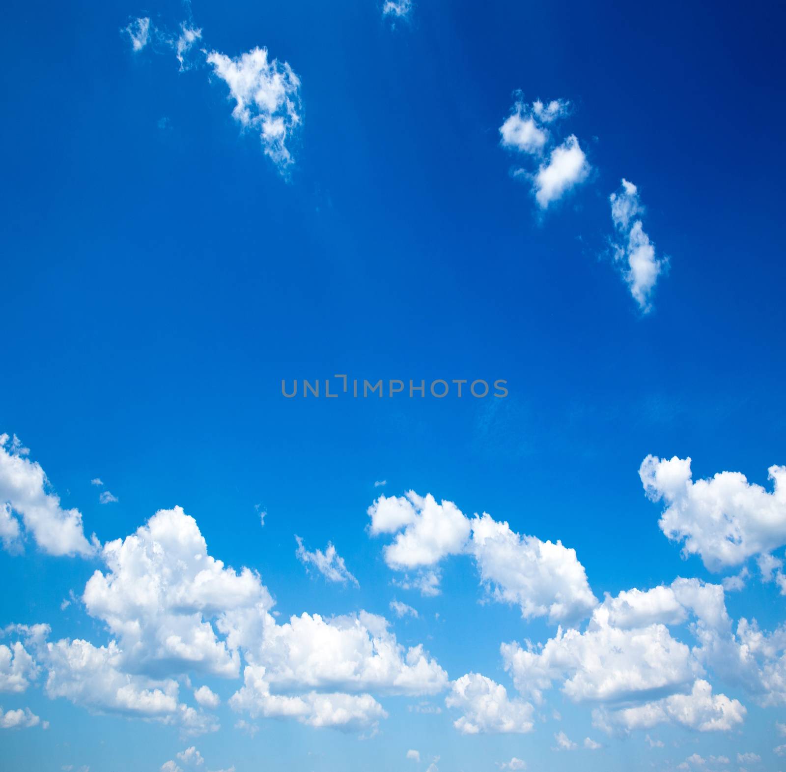 Blue sky background with a tiny clouds