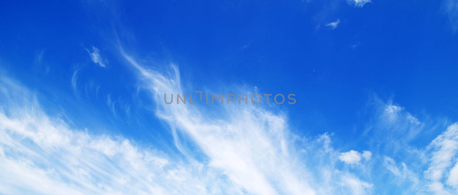 blue sky with clouds and sun