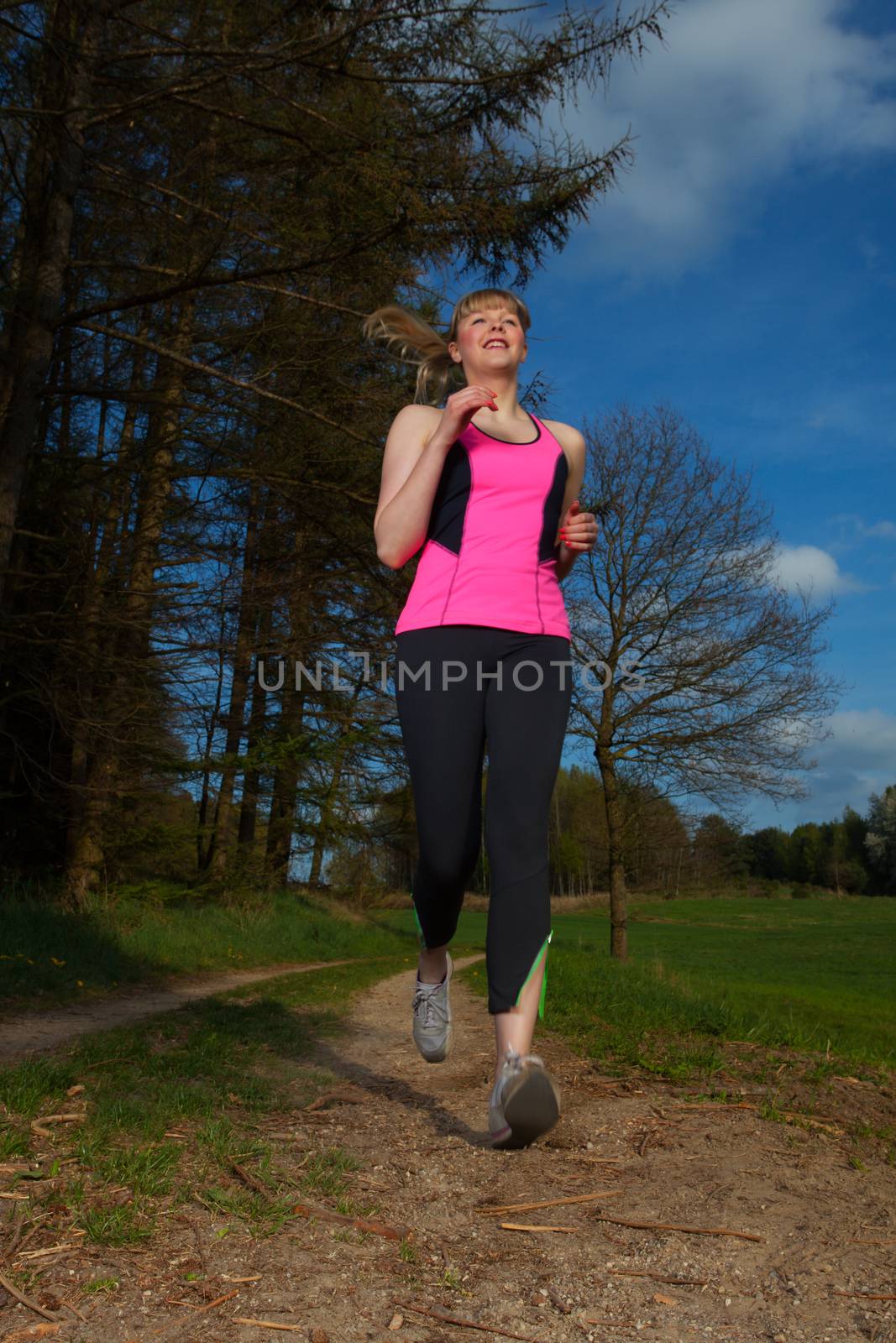 running woman woman, jogging, jog, run, outdoor, young, sport, blonde, fitness, health, athlete, trail, caucasian, runner, training, summer, wood, tree, sun, workout, happy,forest,track,road,gravel,lifestyle,endurance,runner,jogger,sky,blue,pink,shirt