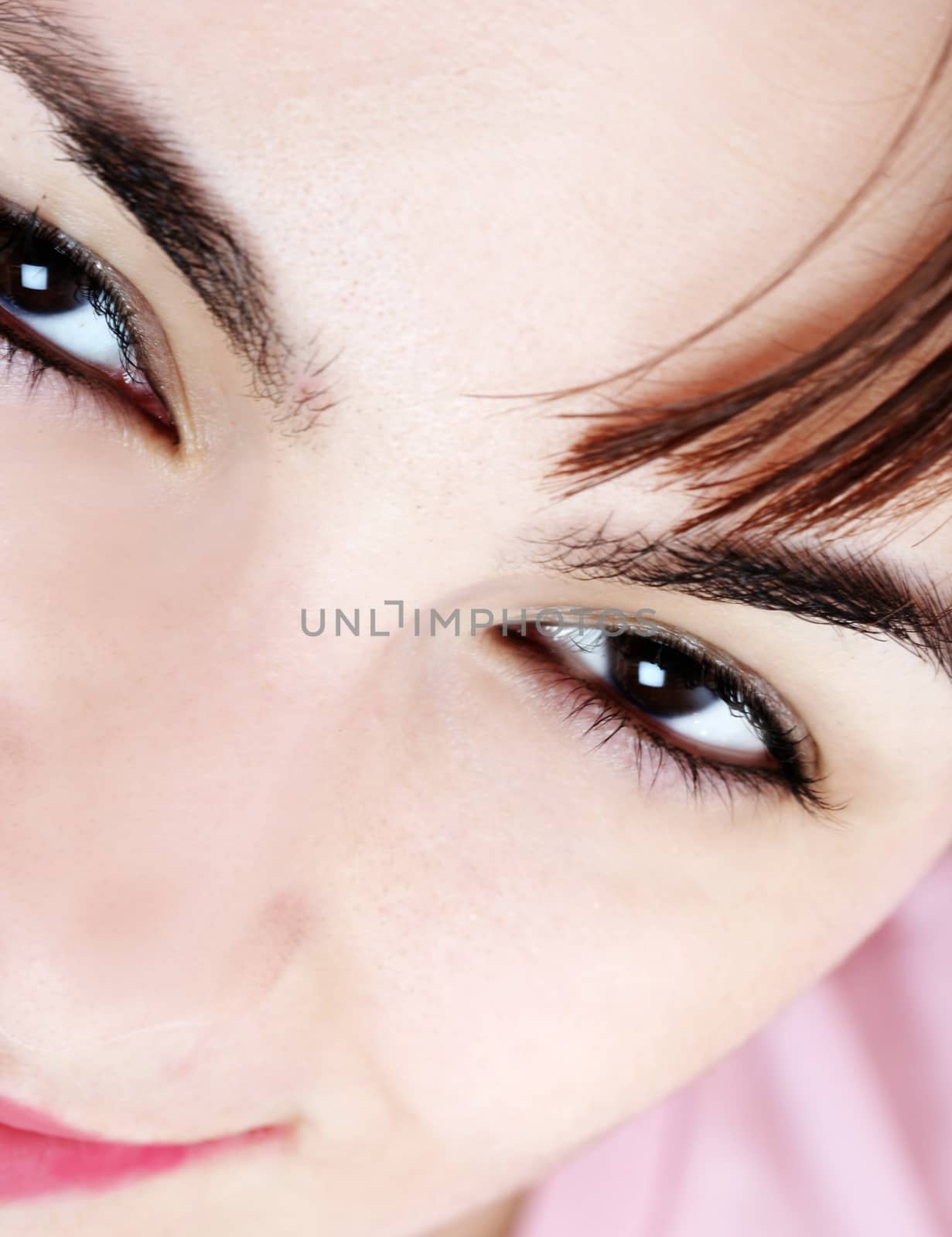 Closeup of beautiful young woman face.