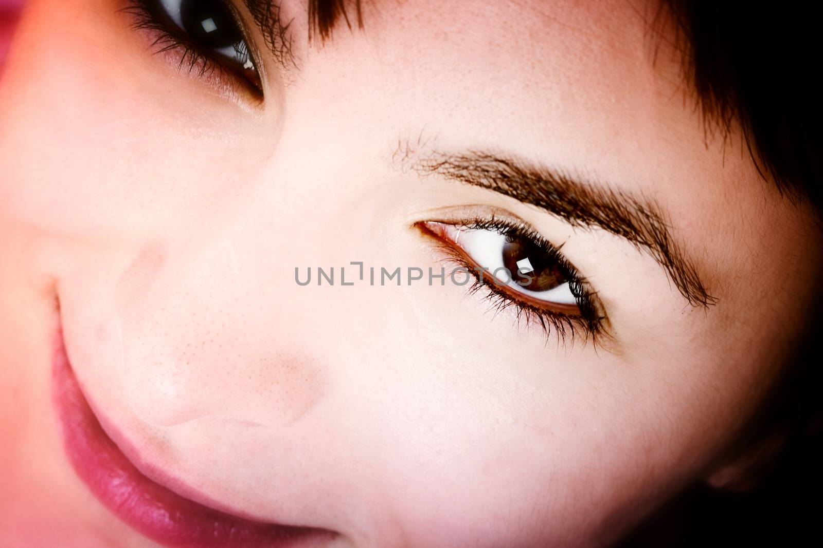 Closeup of beautiful young woman face.