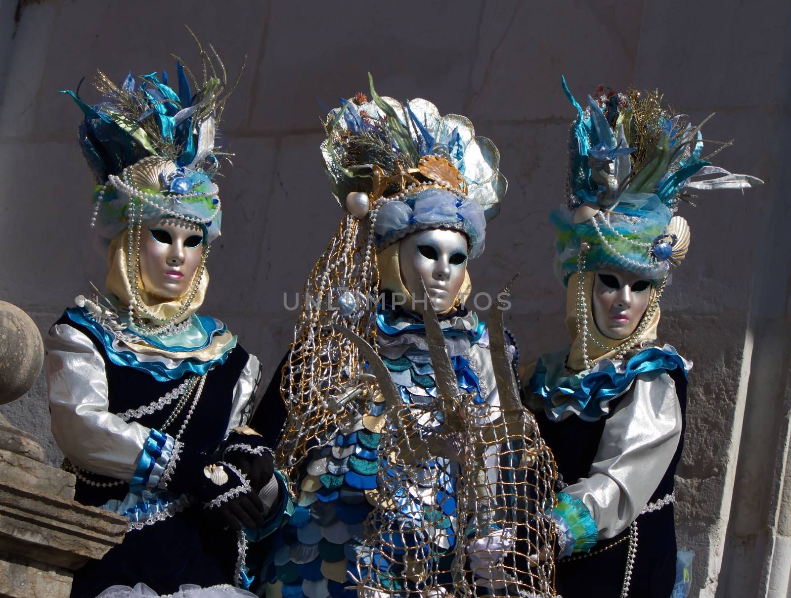 Three blue people at the 2014 Annecy venetian carnival, France