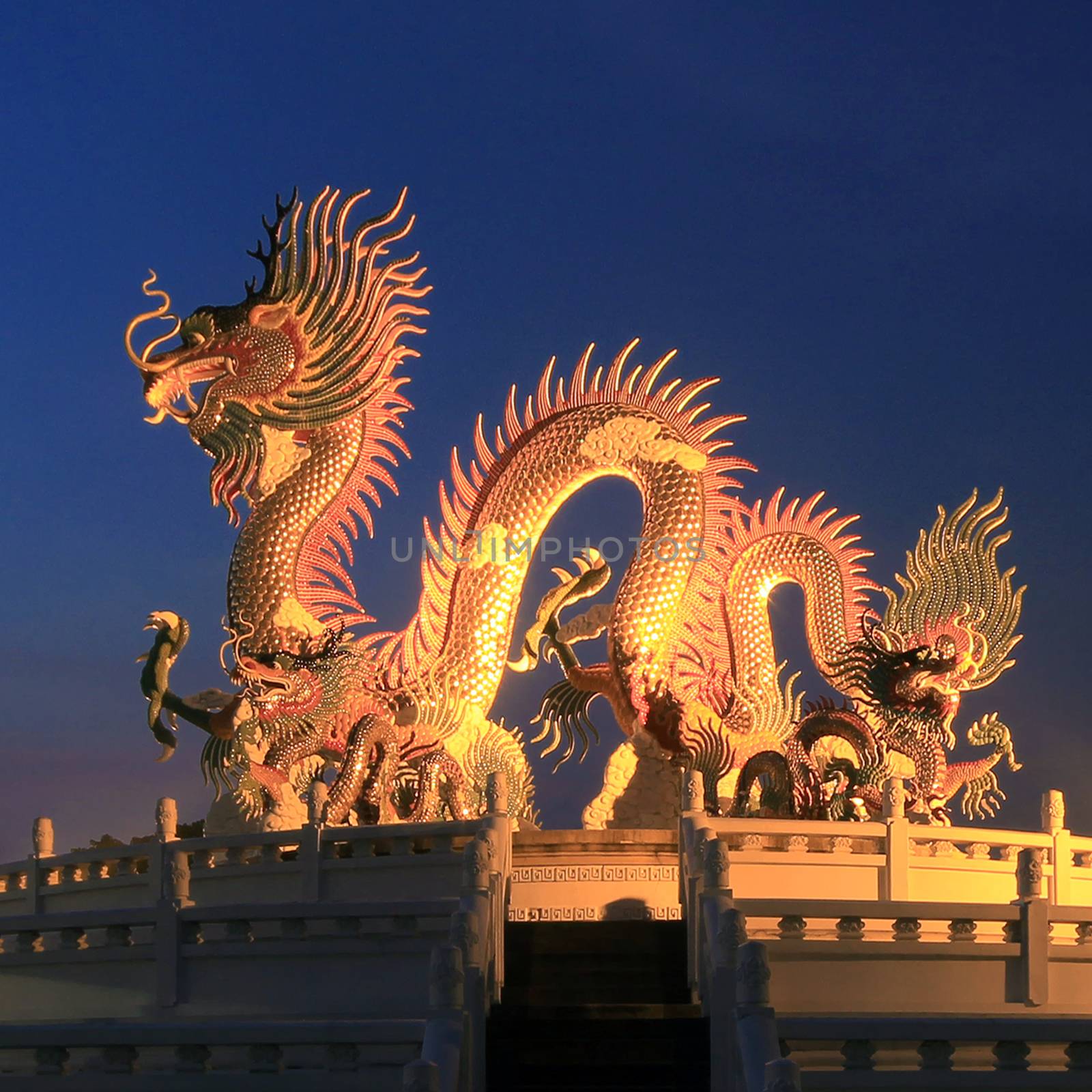 Chinese dragon statue at the twilight time