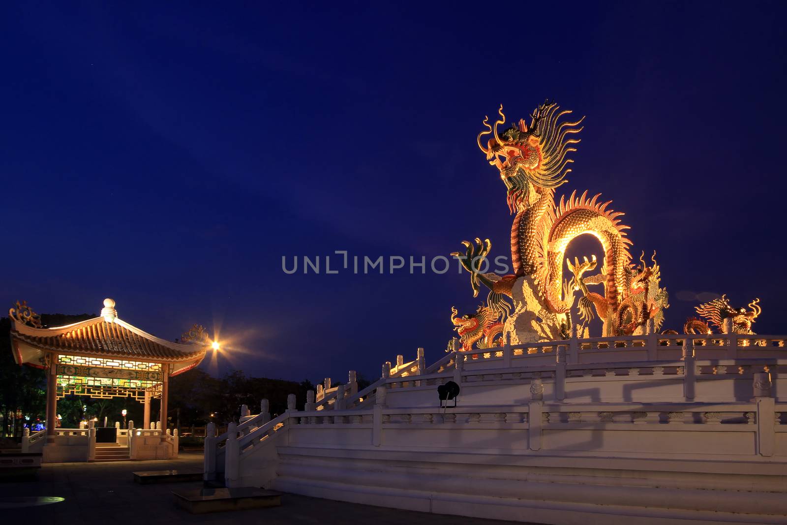 Chinese dragon statue at the twilight time