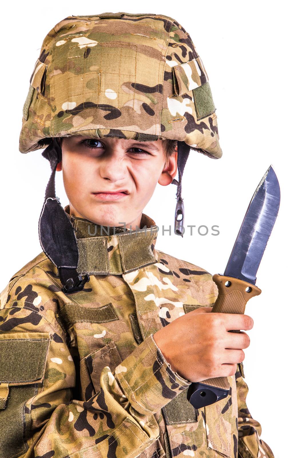 Young boy dressed like a soldier with knife isolated on white