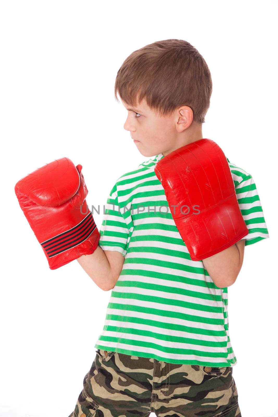 Angry boy pugilist isolated on a white background