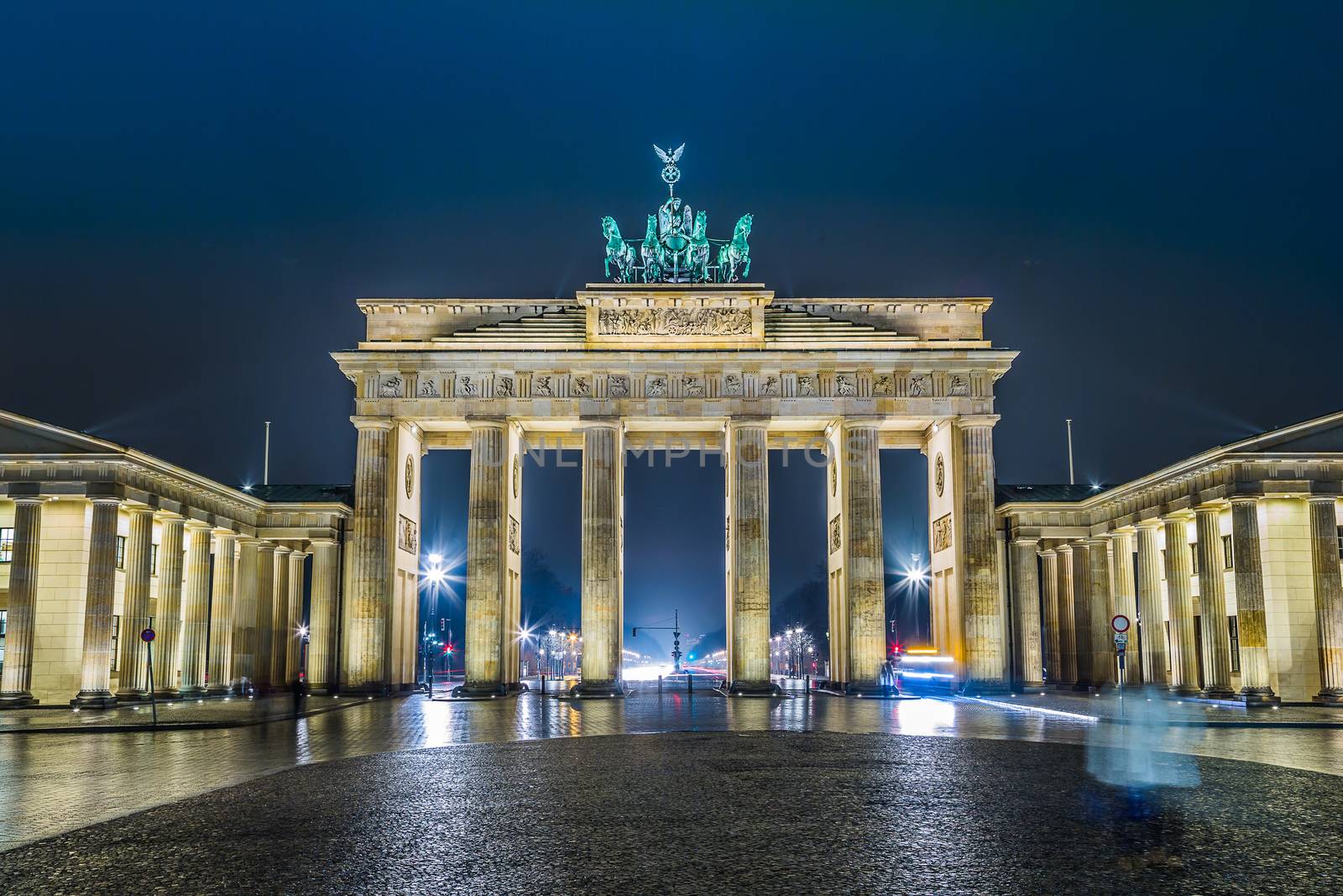 BRANDENBURG GATE, Berlin, Germany at night. Road side view