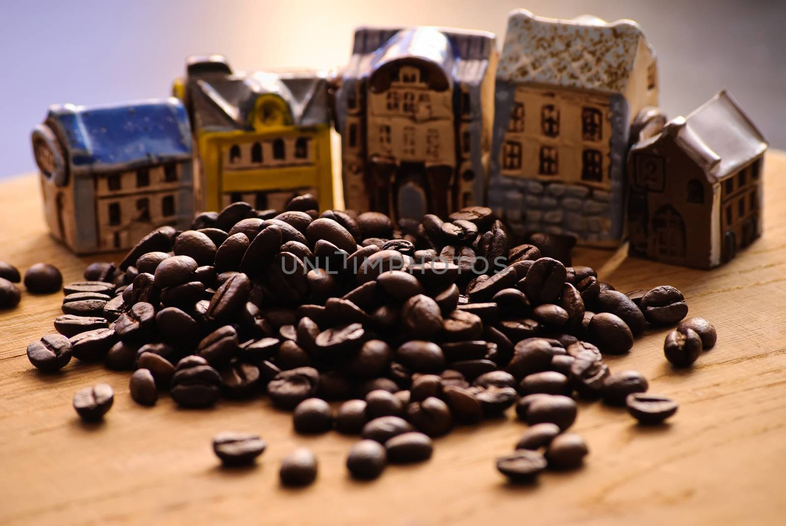 Close-up of roasted coffee beans. And decorative house.