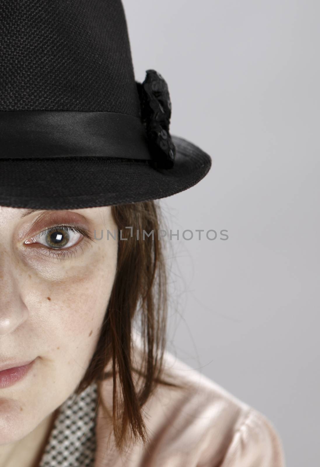 Portret of a young sad woman in studio