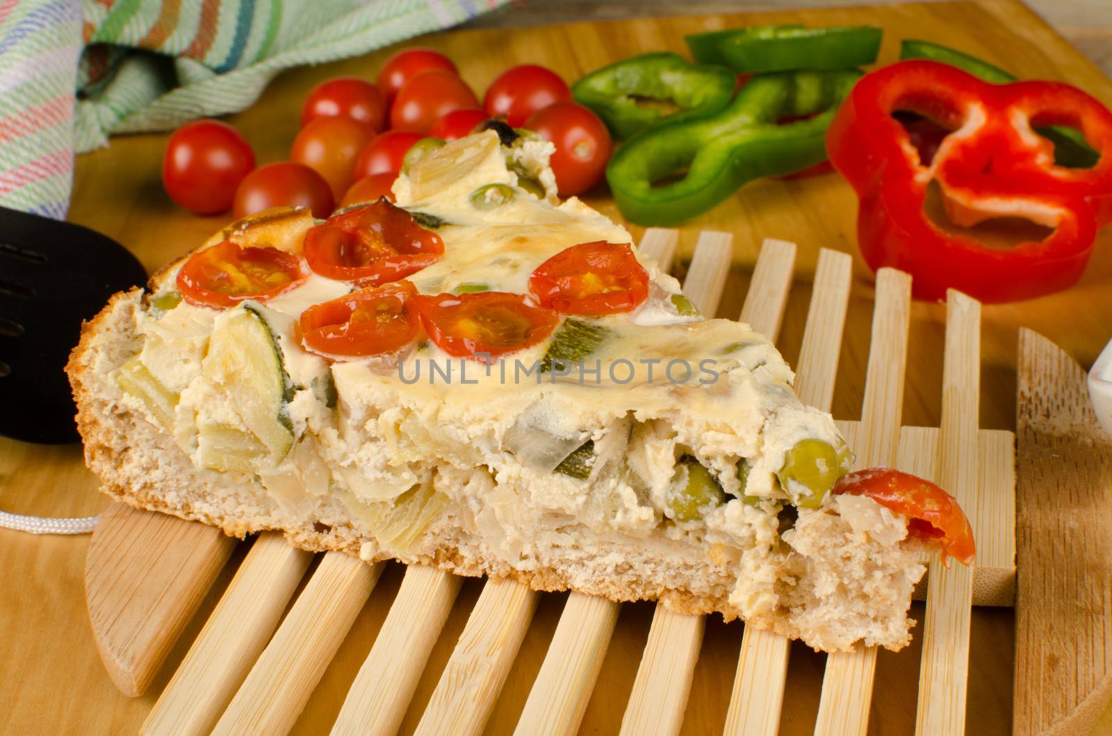 A slice of vegetable cake with some of its ingredients