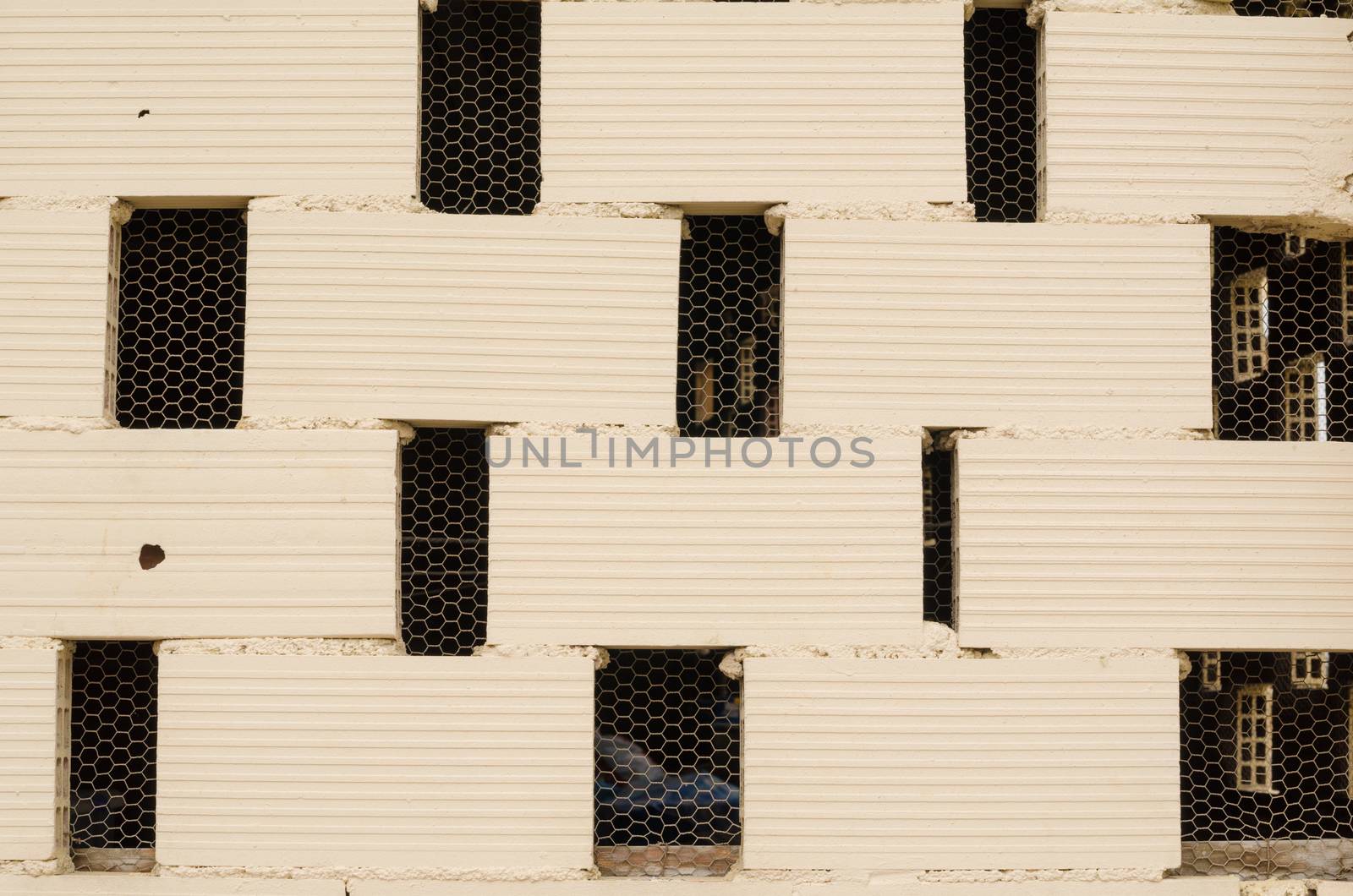 Full frame take of a brick wall with ventilation gaps