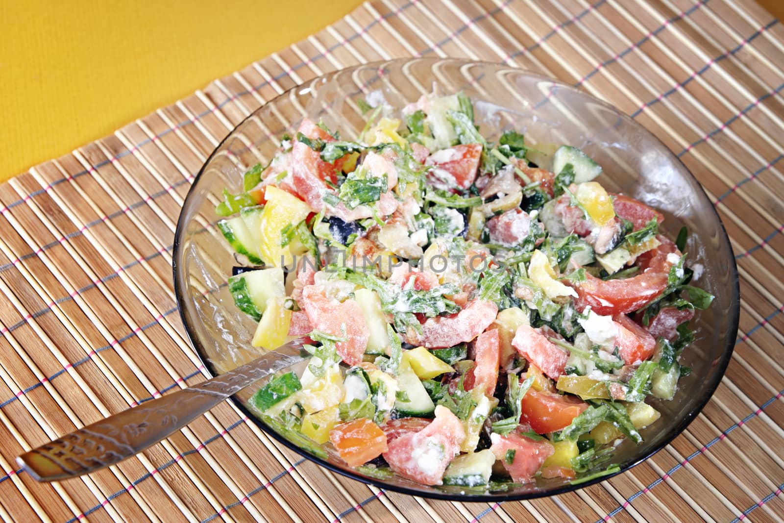 Healthy salad with vegetables and cheese