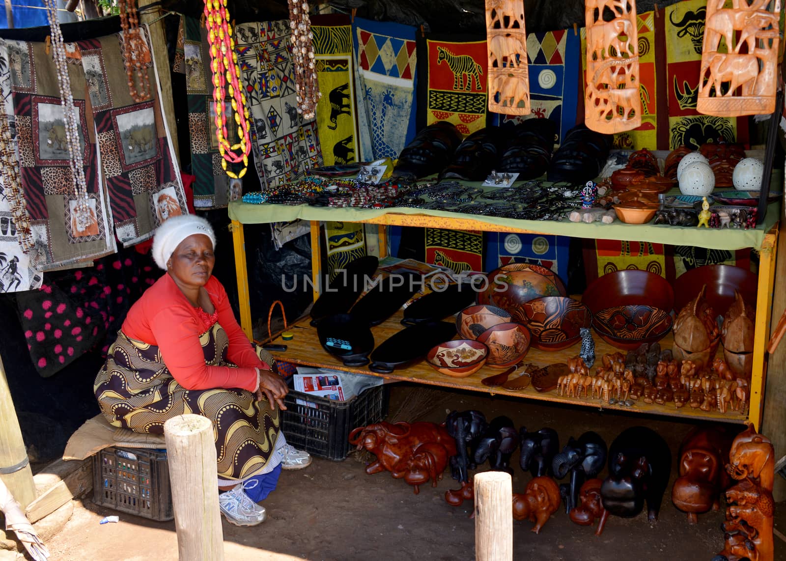 TZANEEN; SOUTH AFRICA- MAR 15; 2014: Unidentified african  woman selling hand made art on the market for tourists on the panarama route.This route is most popular route in south africa
