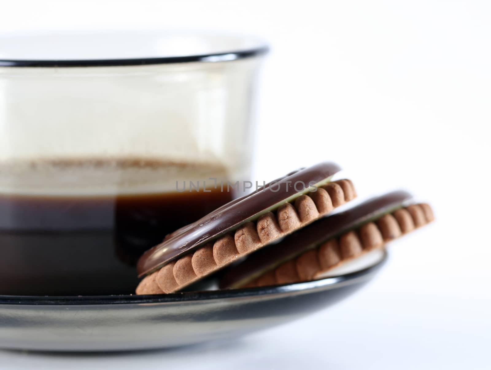 Cup with coffee and cookies.