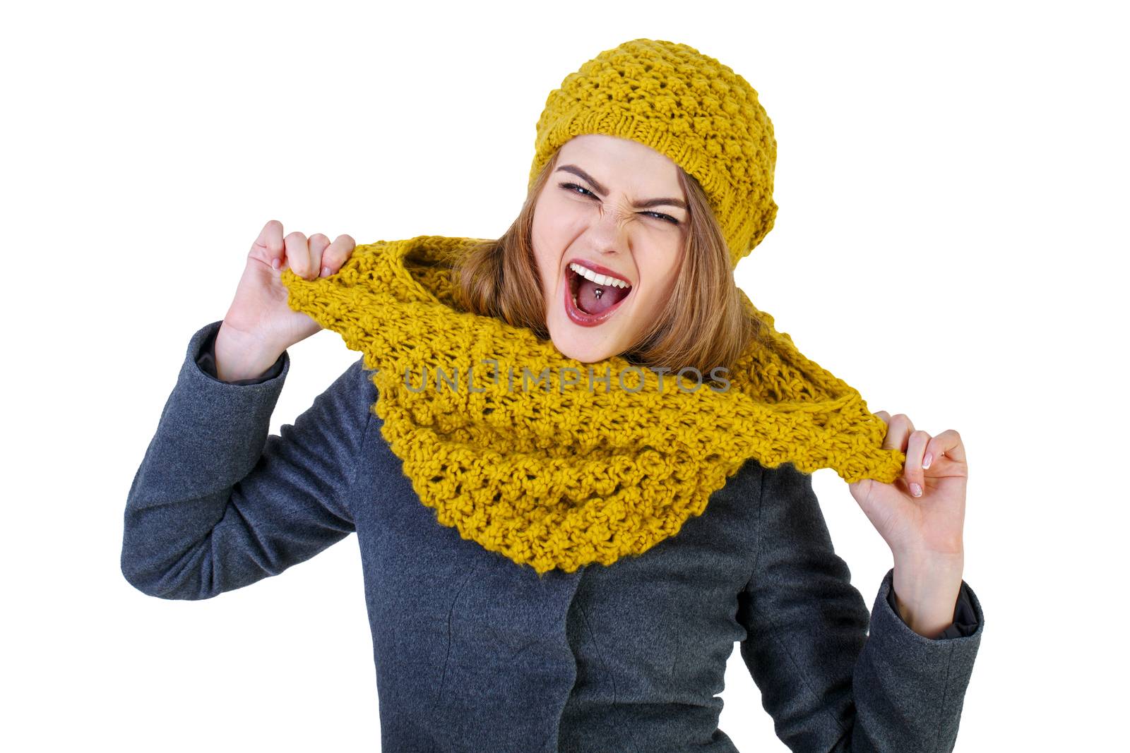 Young attractive Frenchwoman in knitted hat and scarf isolated on white background