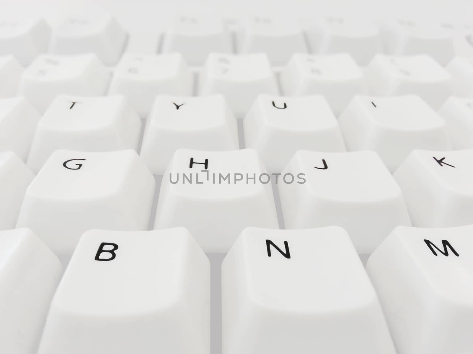 QWERTY Keyboard with white buttons in macro perspective.