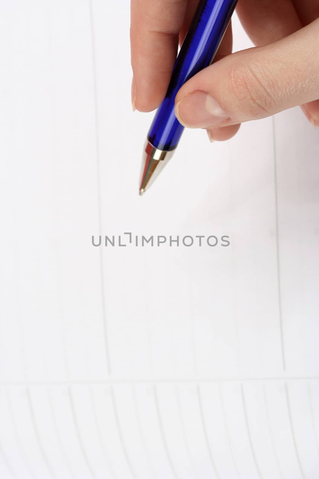 Close-up of woman hand writing in agenda