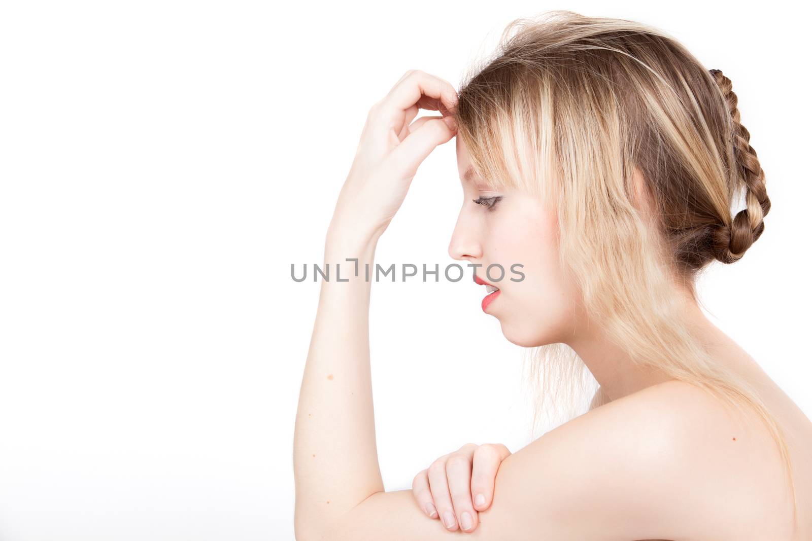 Portrait from young blond woman on a white background with much skin visible