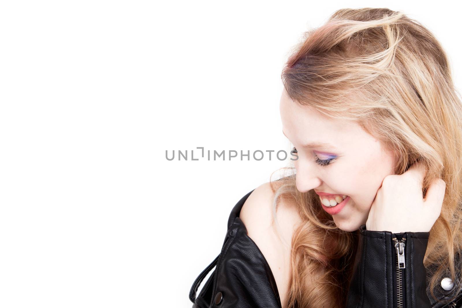 Young tough blond teenage girl with leather jacket on a white background