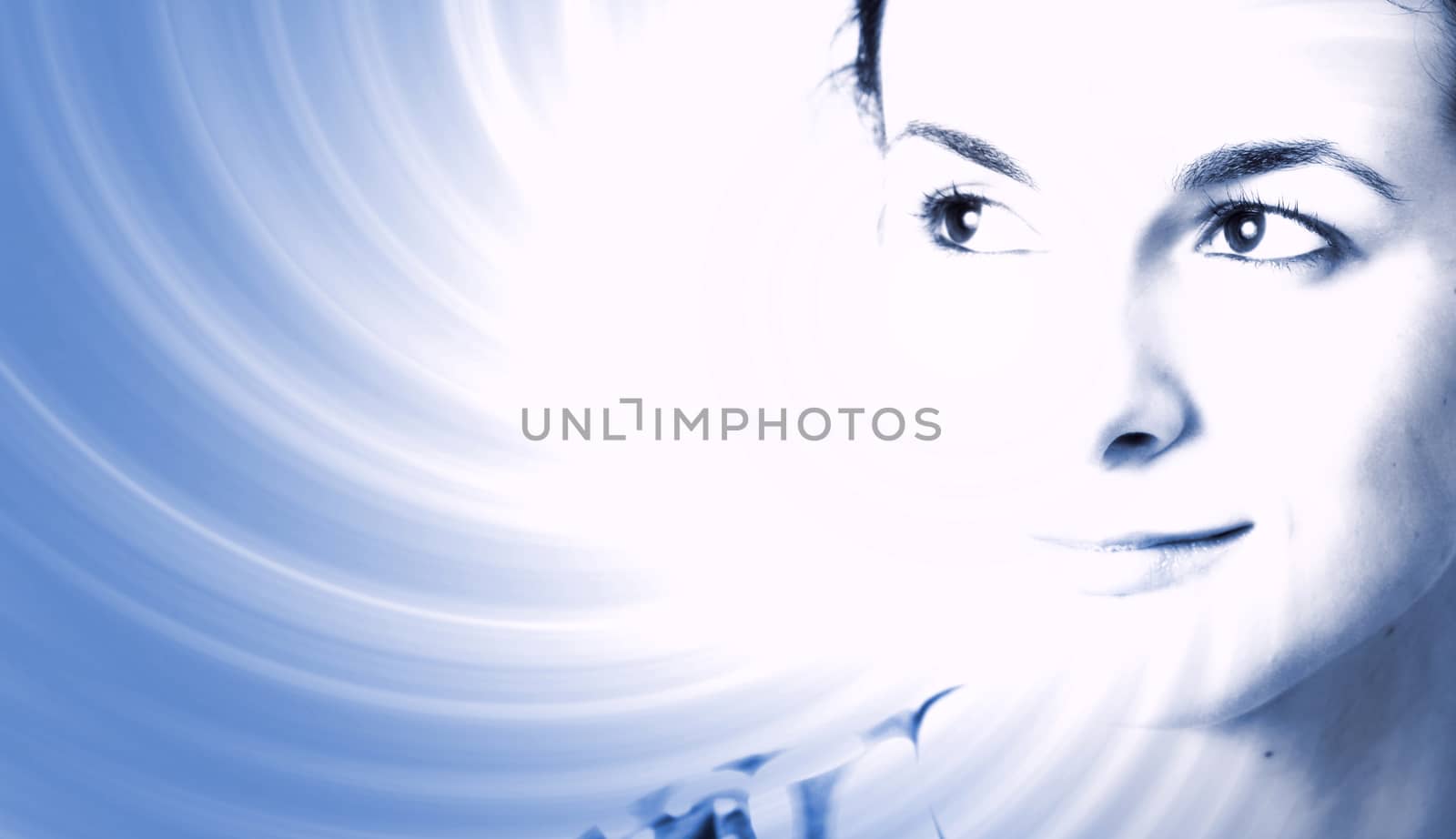 Woman face over ray of light background.