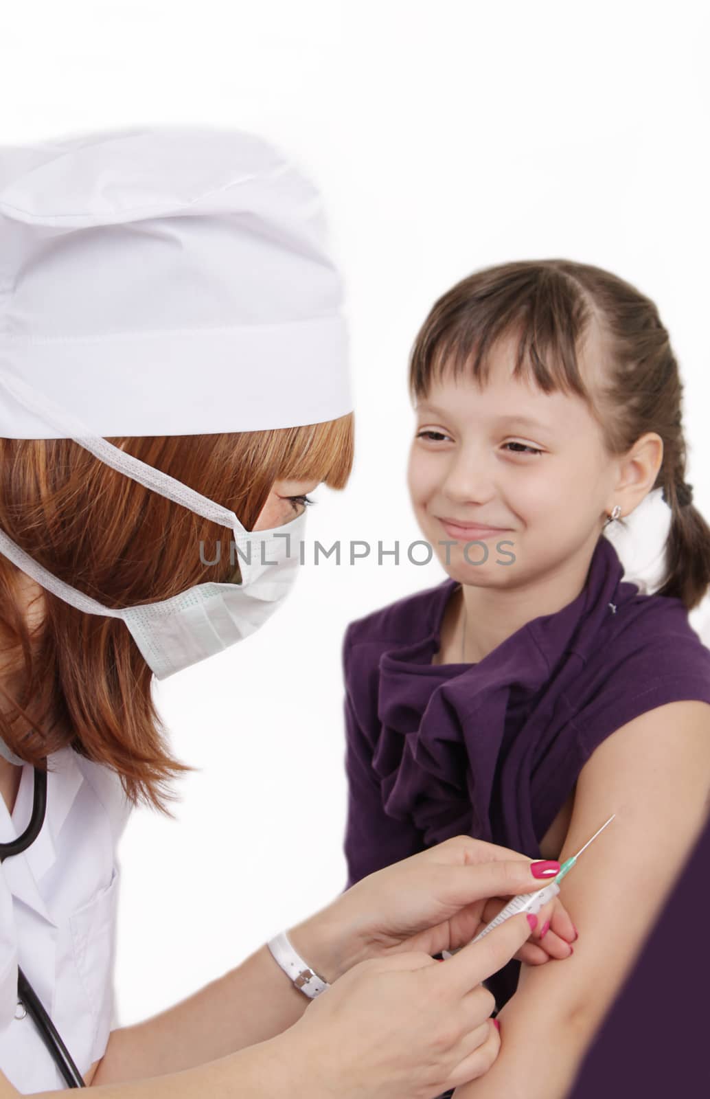 Woman doctor vaccinating girl in hand over white