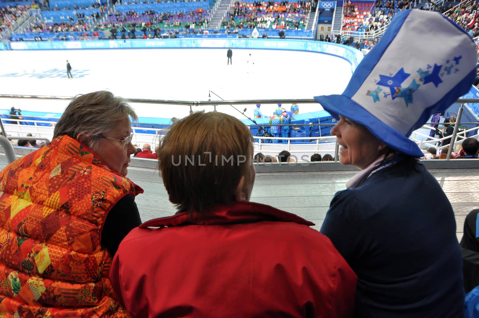 Female spectators at speed skating short-trek stadium, Russia