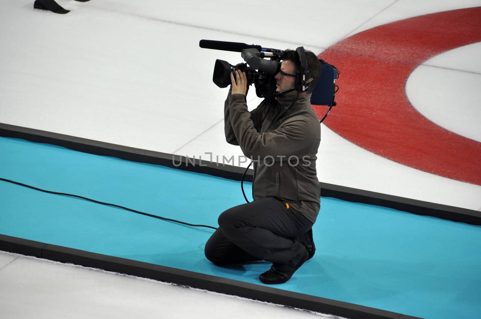 Camera man at XXII Winter Olympic Games Sochi 2014, Russia