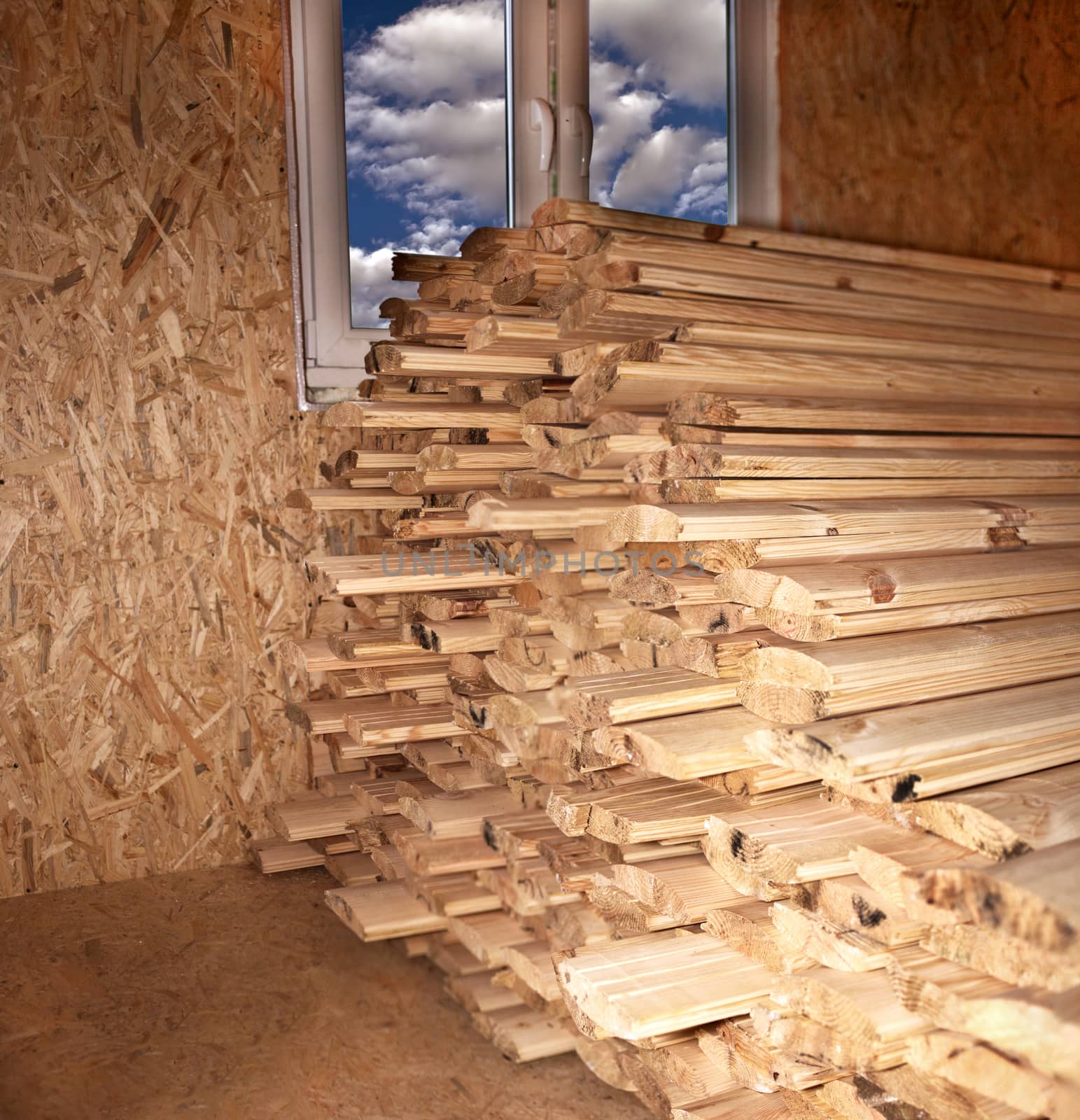 
Construction and finishing materials - wooden blockhouse, folded in a room at a window