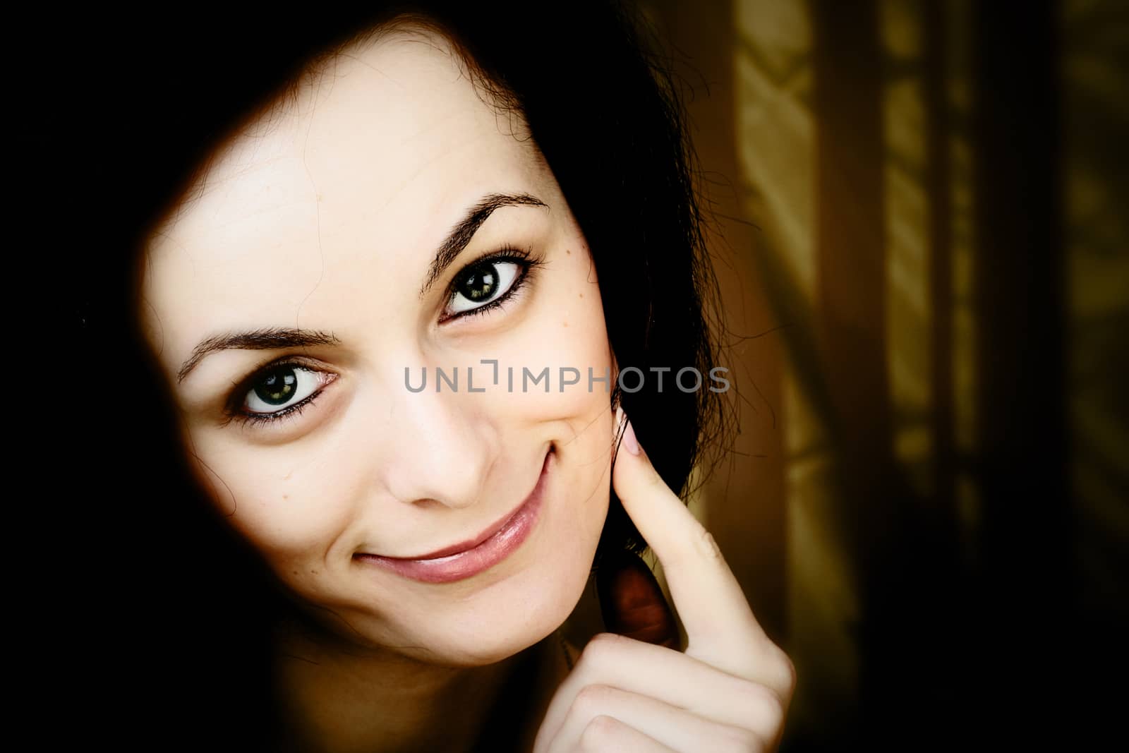 Portrait of a happy beautiful woman with green eyes.