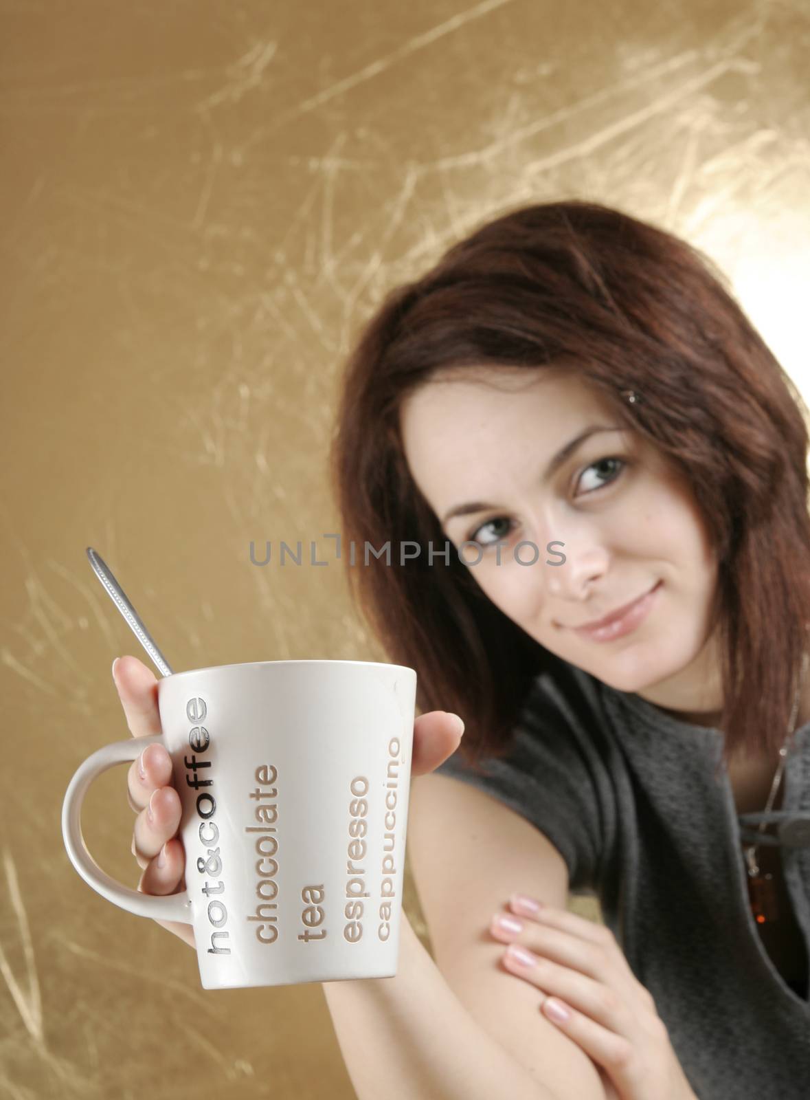 Beautiful woman drinking a cup of coffee