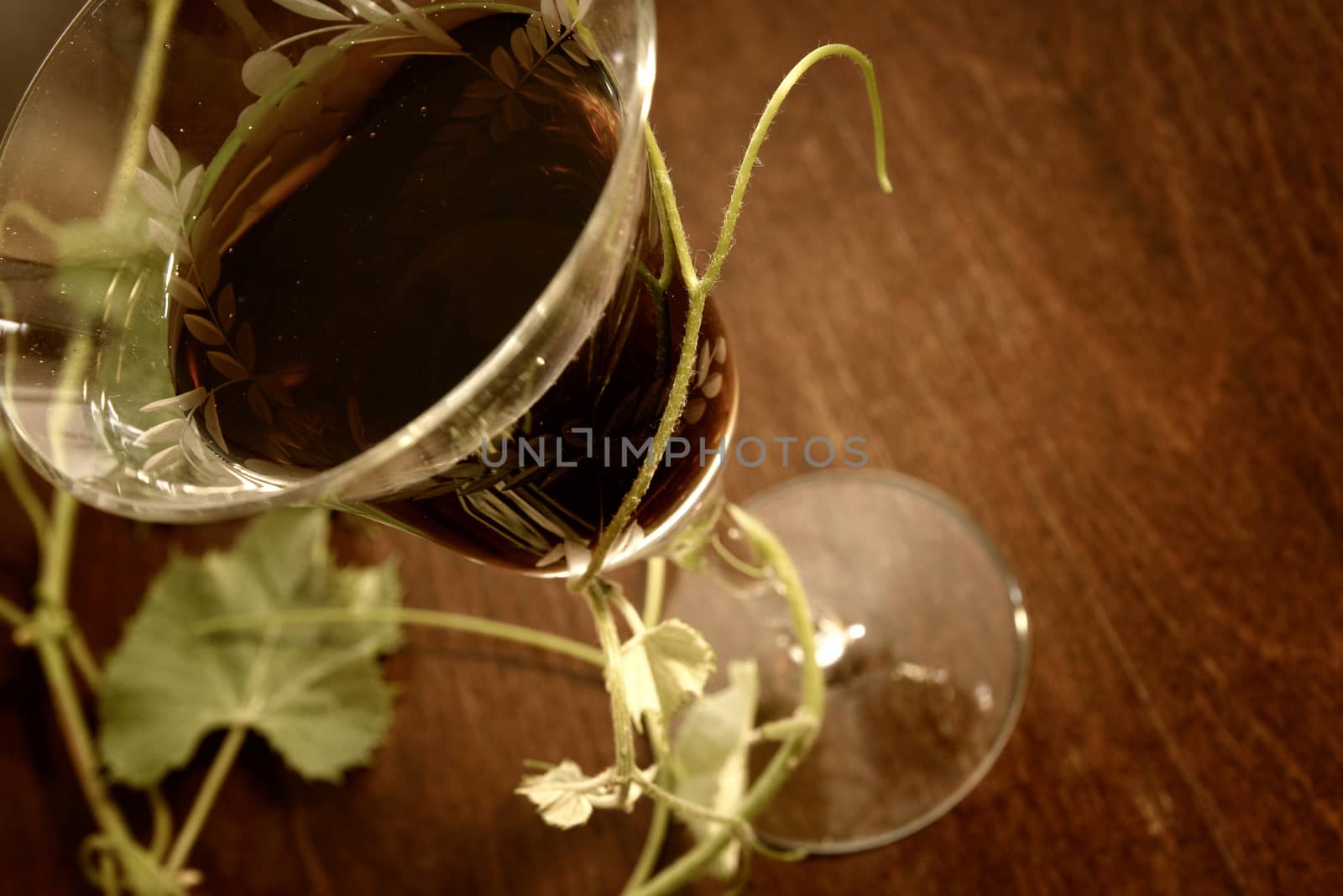 red wine glass isolated on wood background