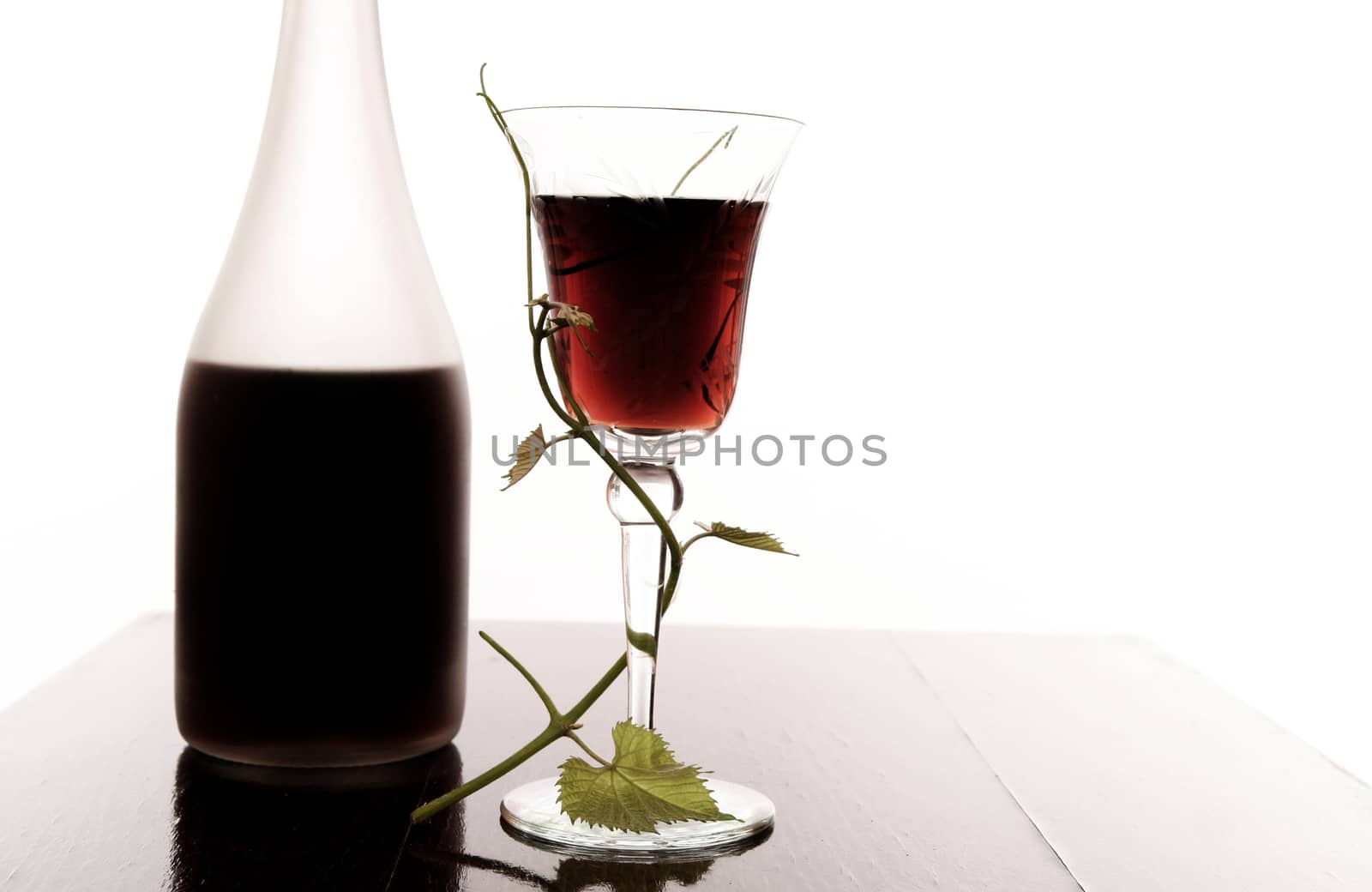 red wine glass and bottle isolated on white