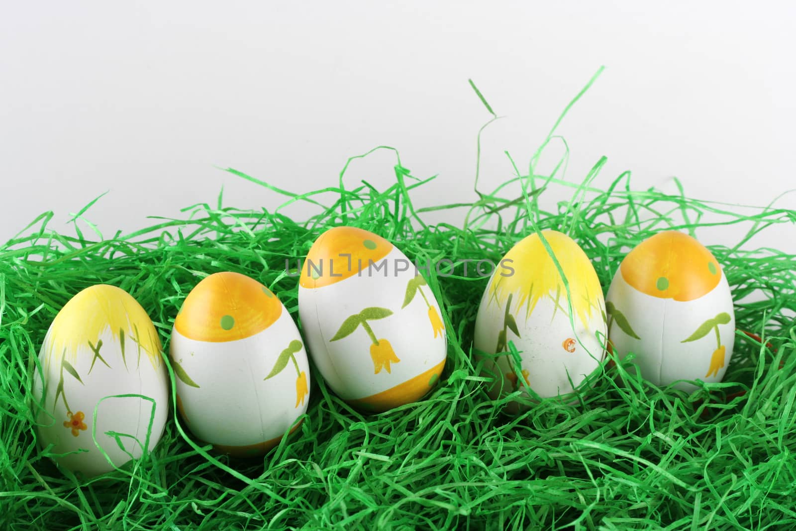 Painted easter eggs in grass.